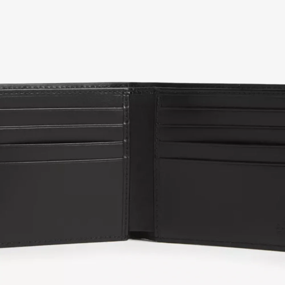 Authentic Gucci Dorian Signature Embossed Leather Bifold Wallet